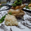 Personal chef created chicken dinner with asparagus and risotto on Asian porcelain plates