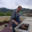 Chef Sean Smith grills steaks at a client's home in Boulder.