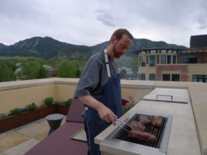 Chef Sean Smith grills steaks at a client's home in Boulder.