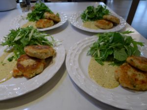 Crab cakes with watercress and mizuna.